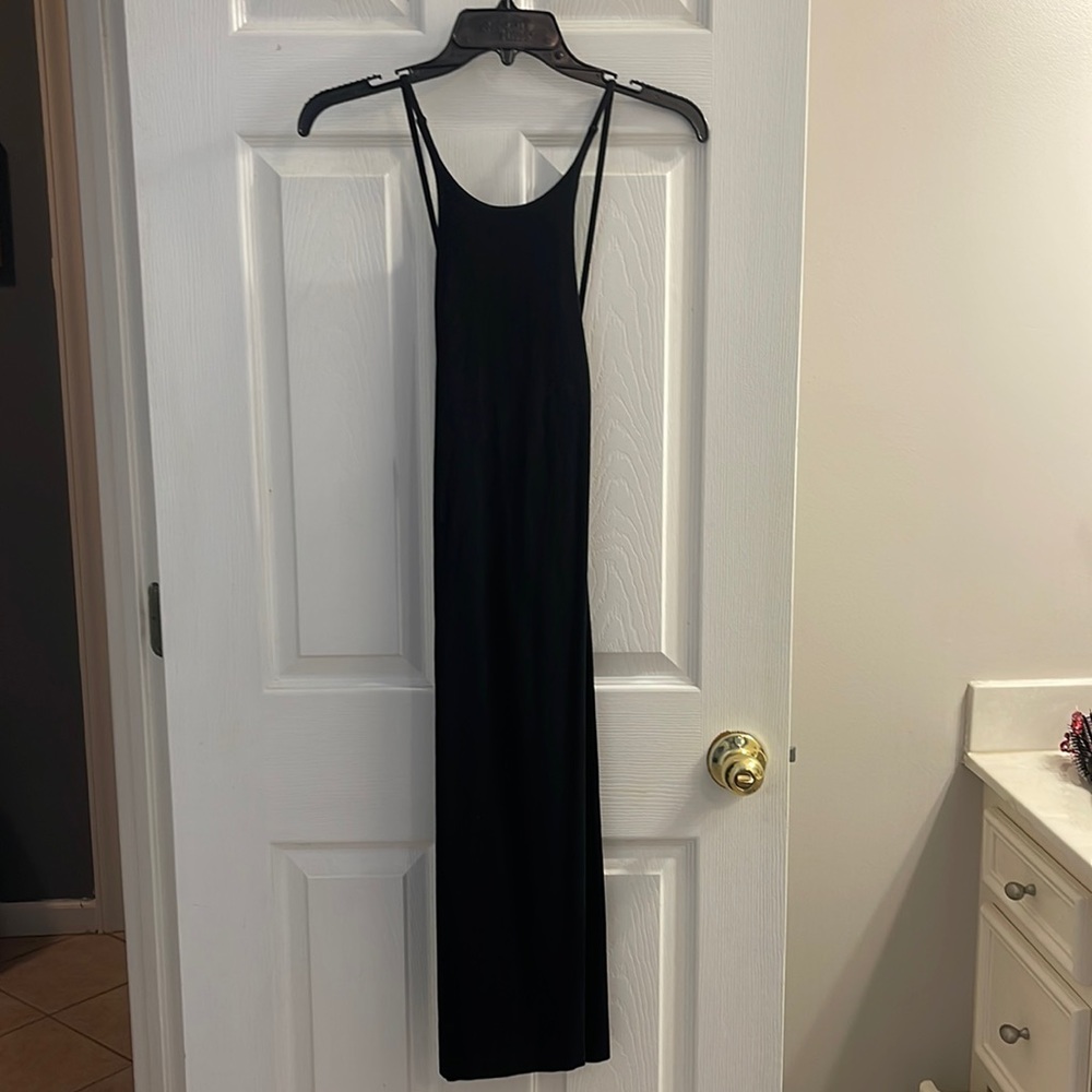 Body fitting black dress from Express. Size small, fits below knee.